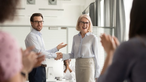 A man and a woman are shaking hands.